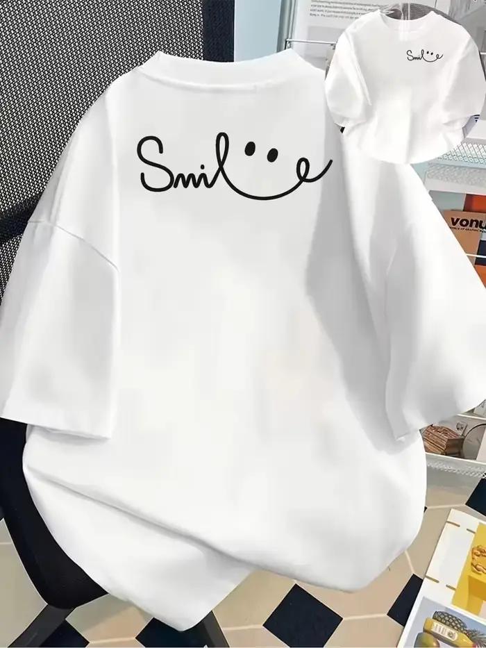 T-shirt graphique coloré avec visage souriant