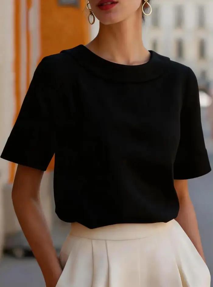 Chemise élégante à manches courtes avec col arrondi et coupe structurée pour femmes