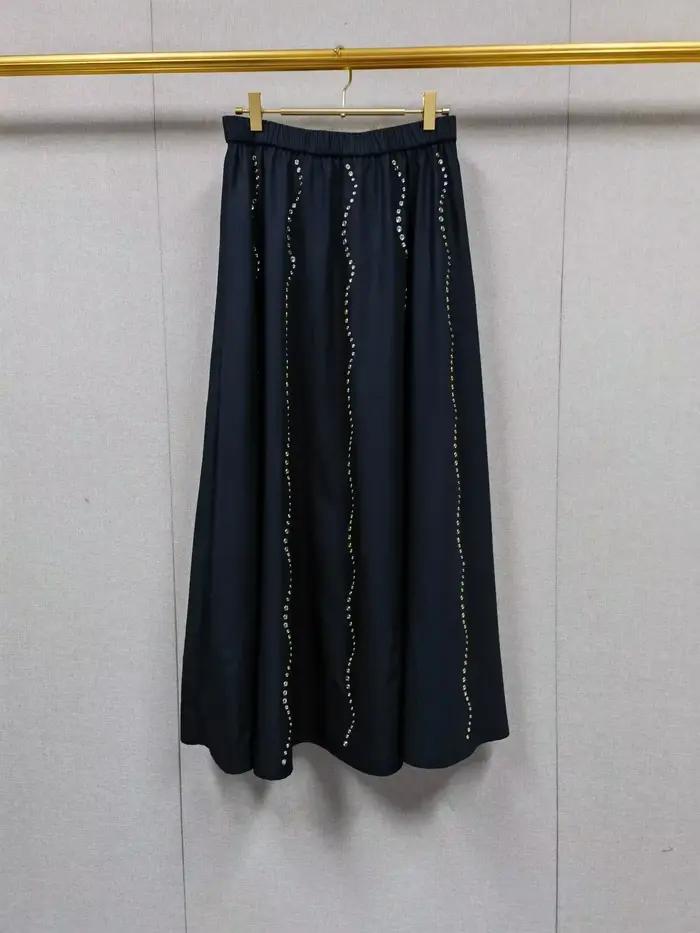 Ensemble haut sans manches à nœud à la taille et jupe midi évasée pour femme