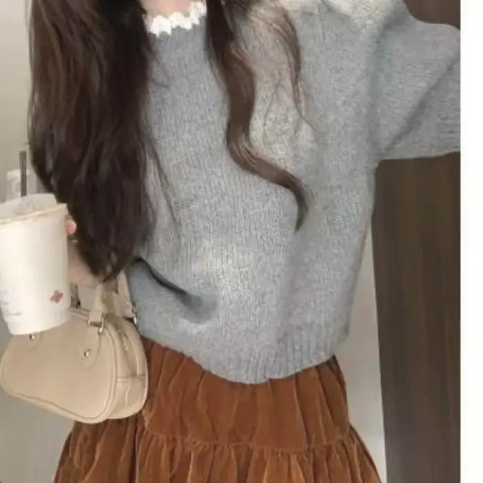 Pull tricoté à demi-col roulé avec manches bouffantes uniques