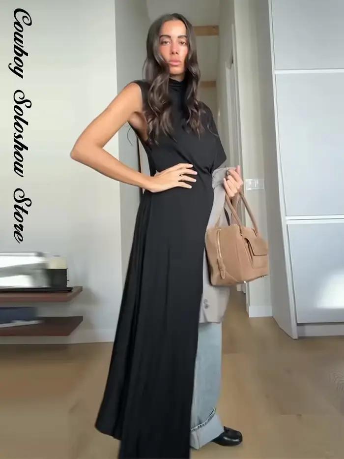 Haut asymétrique noir unique pour femme