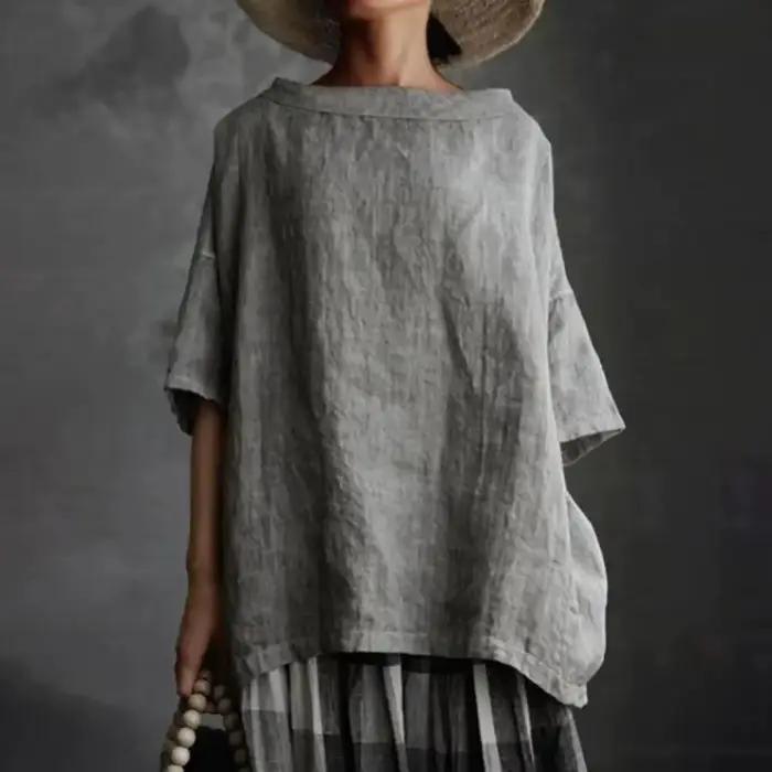 Blouse ample mooclound en polyester et coton pour femmes, style décontracté, couleur unie, hauts estivaux, col rond, demi-manches, pour occasions spéciales et quotidienne ``` 此HTML页面设计用于通过强调产品的舒适性、多功能性和美感来激发潜在客户的兴趣和购买欲。请注意，该描述完全基于提供的特性，并未添加任何虚构的信息。