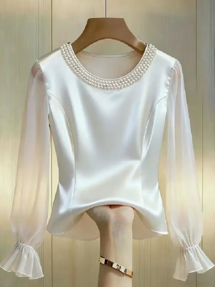 Chemisier élégant à col rond et manches longues en satin et mousseline transparente orné de perles pour femme