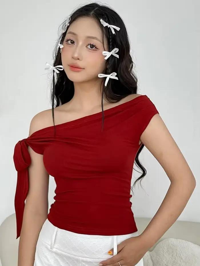 T-shirt asymétrique épaule dénudée en polyester et élasthanne pour femmes, streetwear, haut court solide, accessoires Y2K, vêtements asymétriques, sans manches, idéal pour les sorties nocturnes