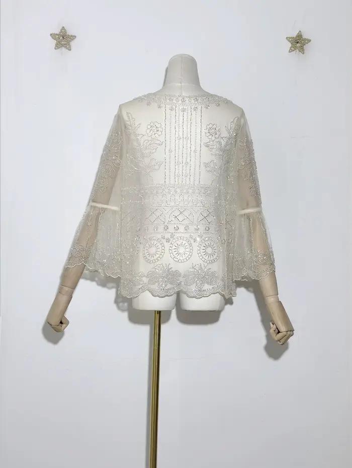 Tunique transparente brodée délicate pour femmes