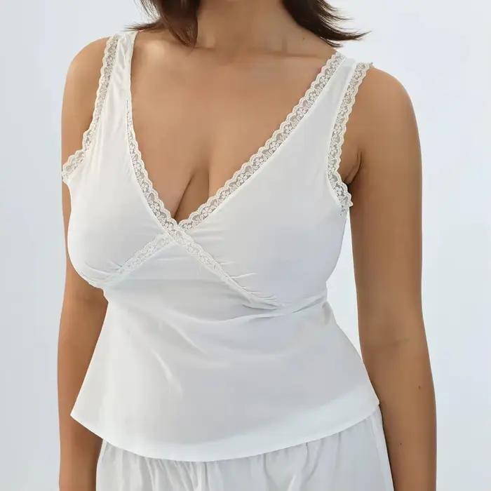 Chemisier en dentelle à col en V en pur coton avec lien à nouer au dos pour cintrer la taille