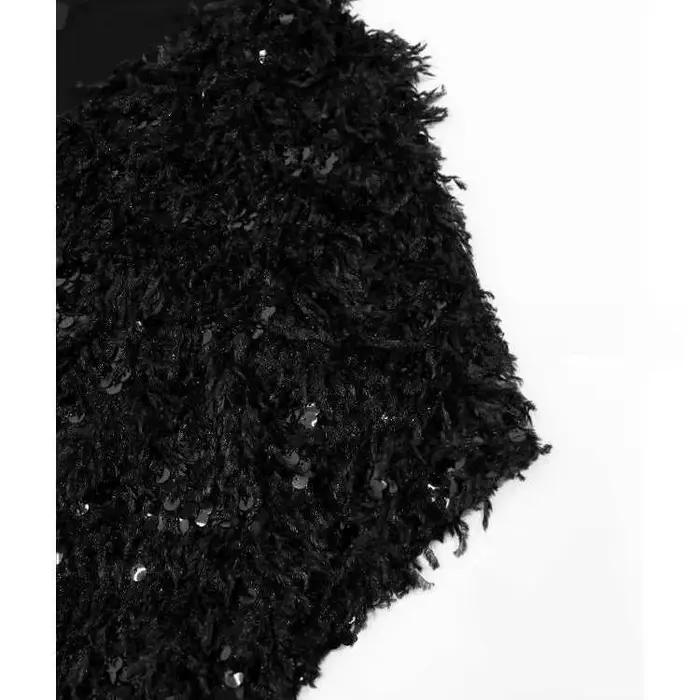 Pull en maille à sequins et pompons