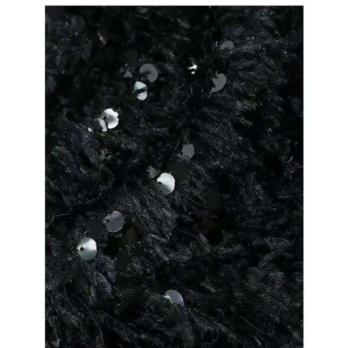 Pull en maille à sequins et pompons