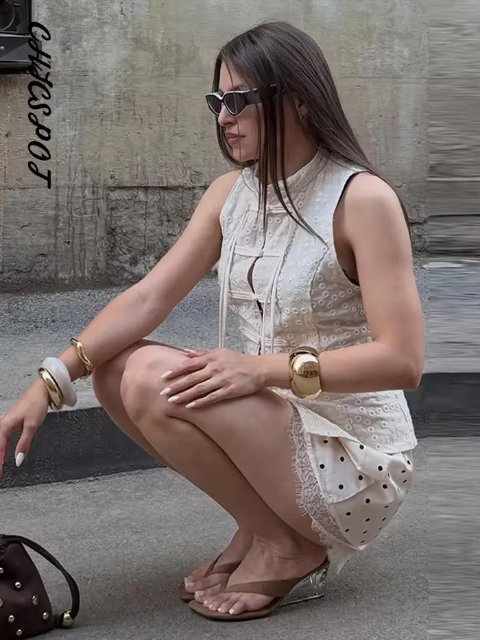 Nouveaux hauts pour femmes à broderie ajourée et boutons grenouillère, sexy, à col montant, sans manches, à simple boutonnage, gilets ajustés, élégants pour soirées