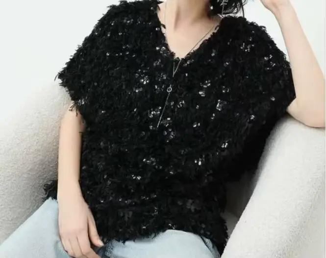 Pull en maille à sequins et pompons