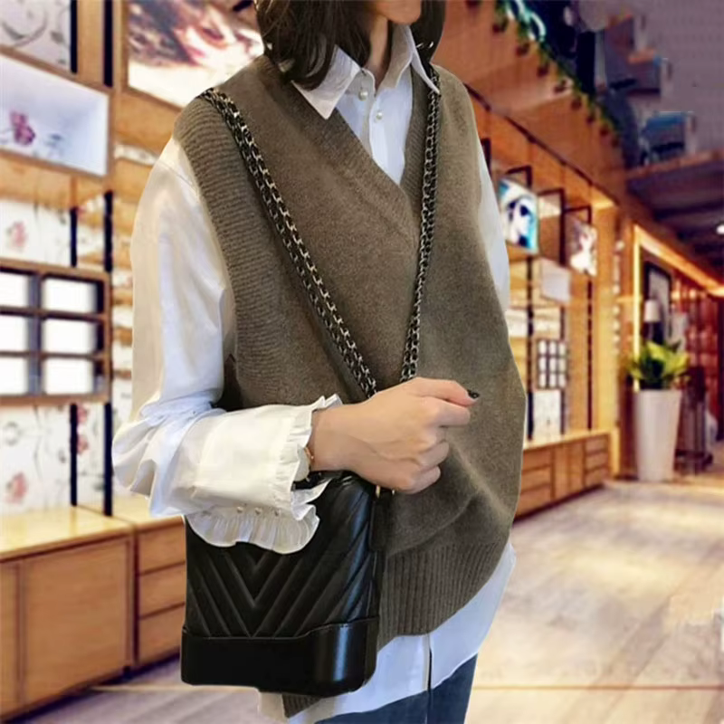 Gilet pull sans manches pour femme, couleur unie, coupe ample, col en V, gilet tricoté, idéal pour l'automne et l'hiver, vêtement de base décontracté, gilet en tricot.